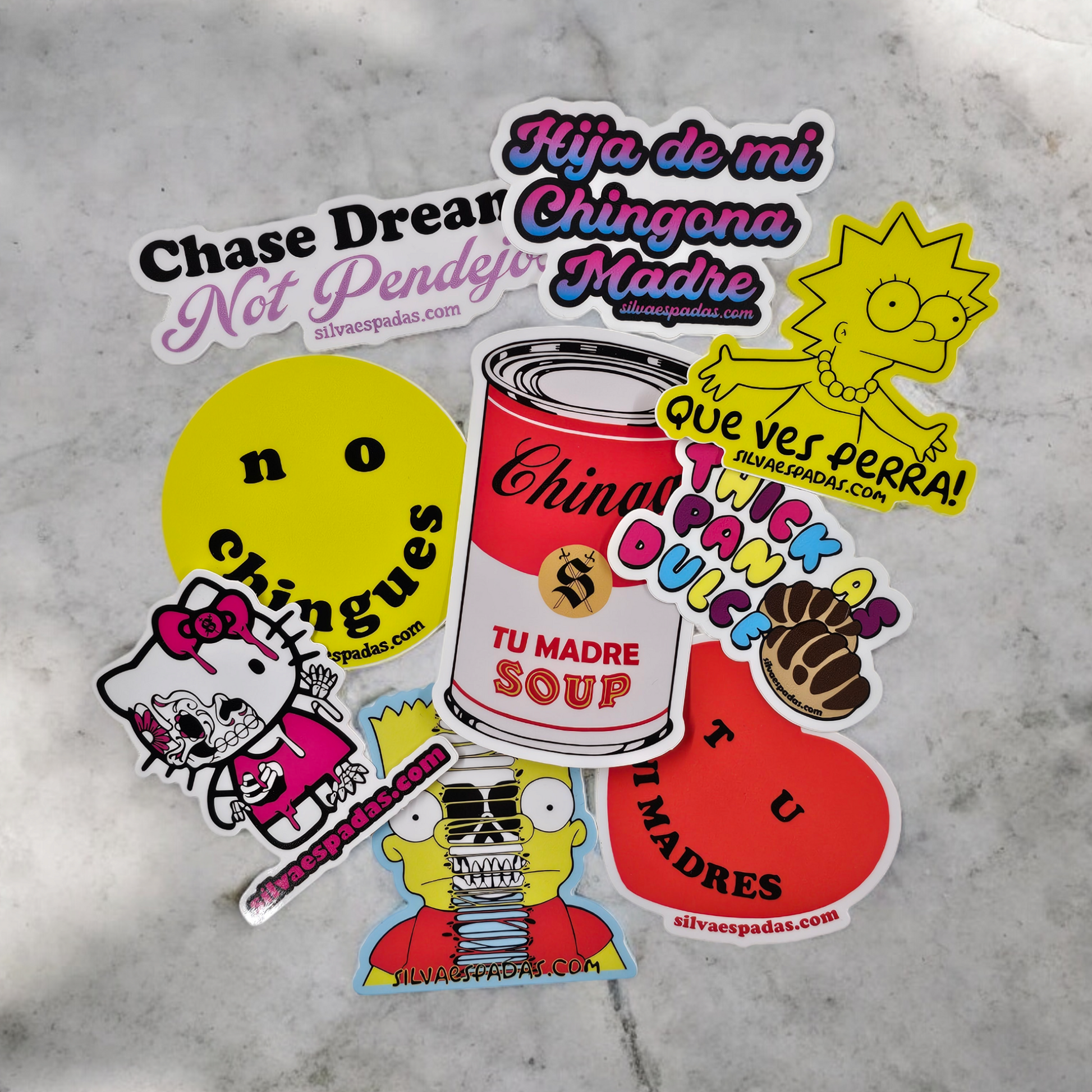 A collection of colorful die-cut pop culture & Latino-inspired designs stickers featuring various designs, including text-based stickers and cartoon character stickers.