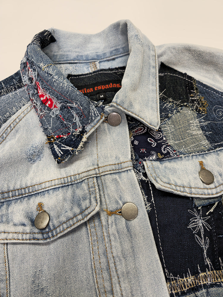 Close-up of repurposed denim jacket showing stitched patch panels in various textures and indigo wash tones