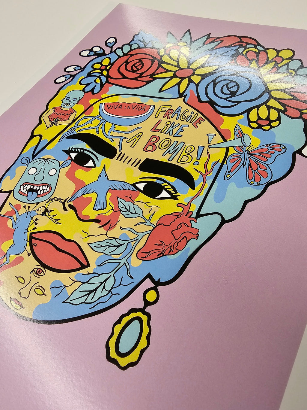 Art print of Frida Khalo made up of some of her paintings on a light purple background 