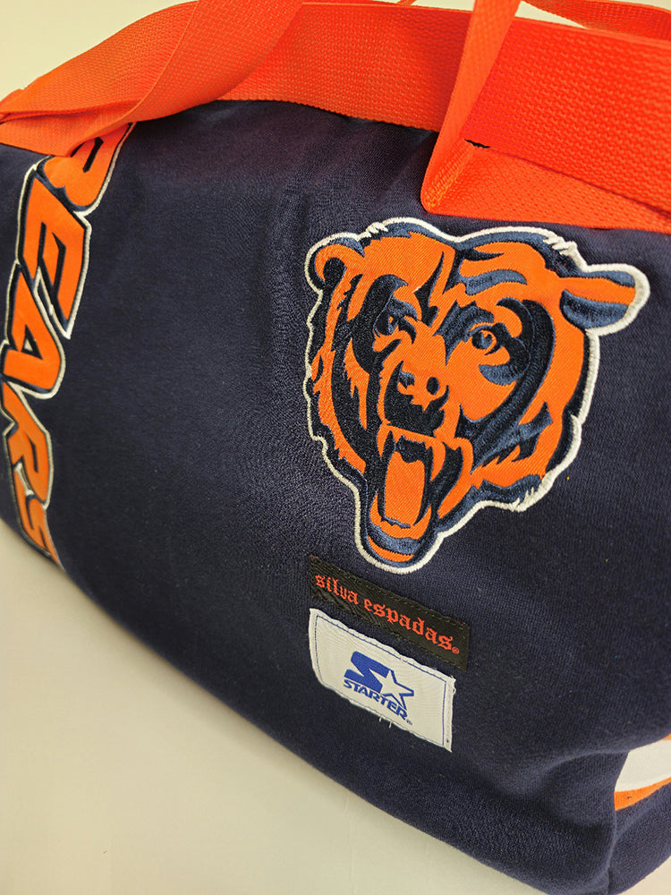 A navy and orange handmade duffle bag with a Chicago Bears logo and Starter label