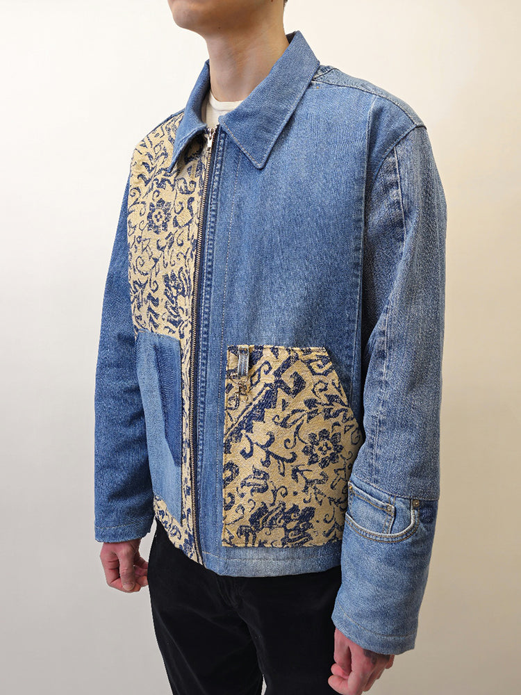 Person modeling a handmade denim floral jacket