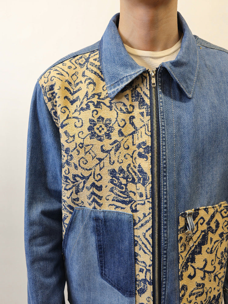 Close up view of a denim floral jacket that is repurposed from upcycled jeans