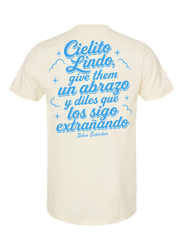 Beige t-shirt with blue text on a white background