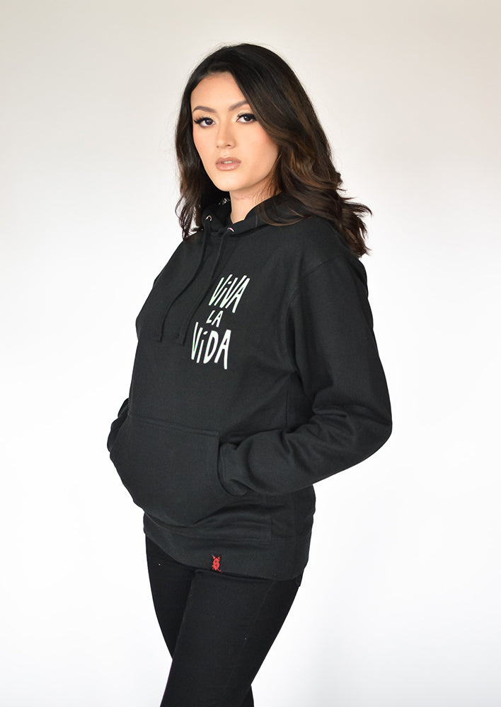 Model wearing Frida Hoodie – unisex Mexican-inspired streetwear by Silva Espadas