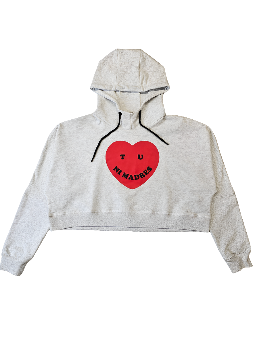 Light gray cropped women's hoodie with a red heart screen printed on the front with the phrase "Tu ni madres" printed on the front