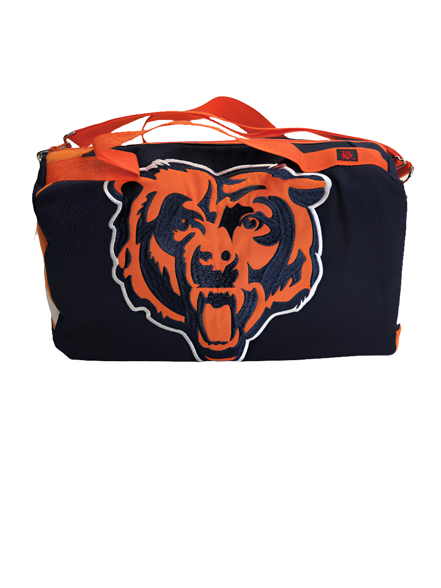 A navy and orange handmade duffle bag with a Chicago Bears logo upcylced from a jacket