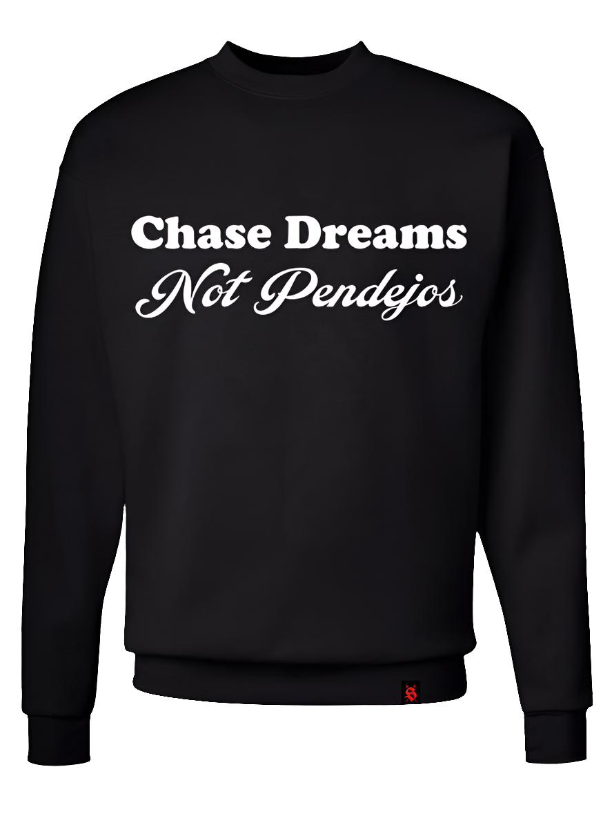 Black sweater with white screen printed text saying " Chase Dreams Not Pendejos "