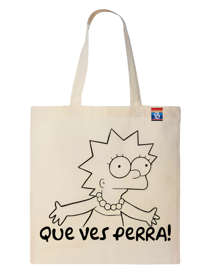 A beige tote bag featuring a cartoon character and the text 'QUE VES PERRA!'