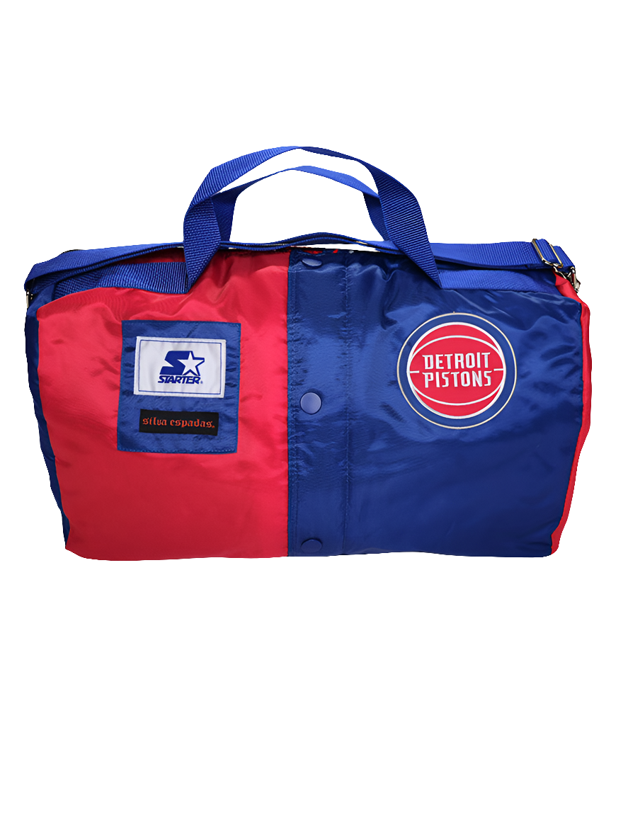 A custom handmade duffle bag made from a Detroit Pistons Starter jacket with the Pistons and Starter brand logo