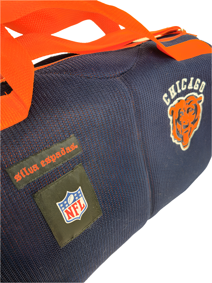 A navy blue handmade Chicago Bears duffle bag with the NFL logo and orange straps