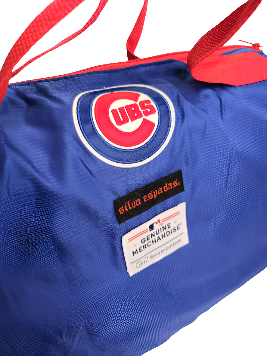 A handmade blue duffle bag with the text 'CHICAGO CUBS' in red letters, featuring a red adjustable strap and a branded logo on the side.