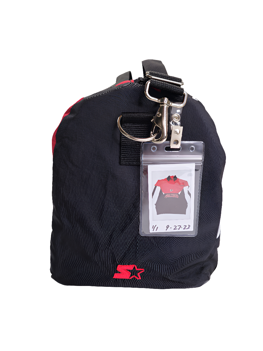 A red and black handmade duffle bag with the Atlanta Falcons logo and starter jacket hoodie design.