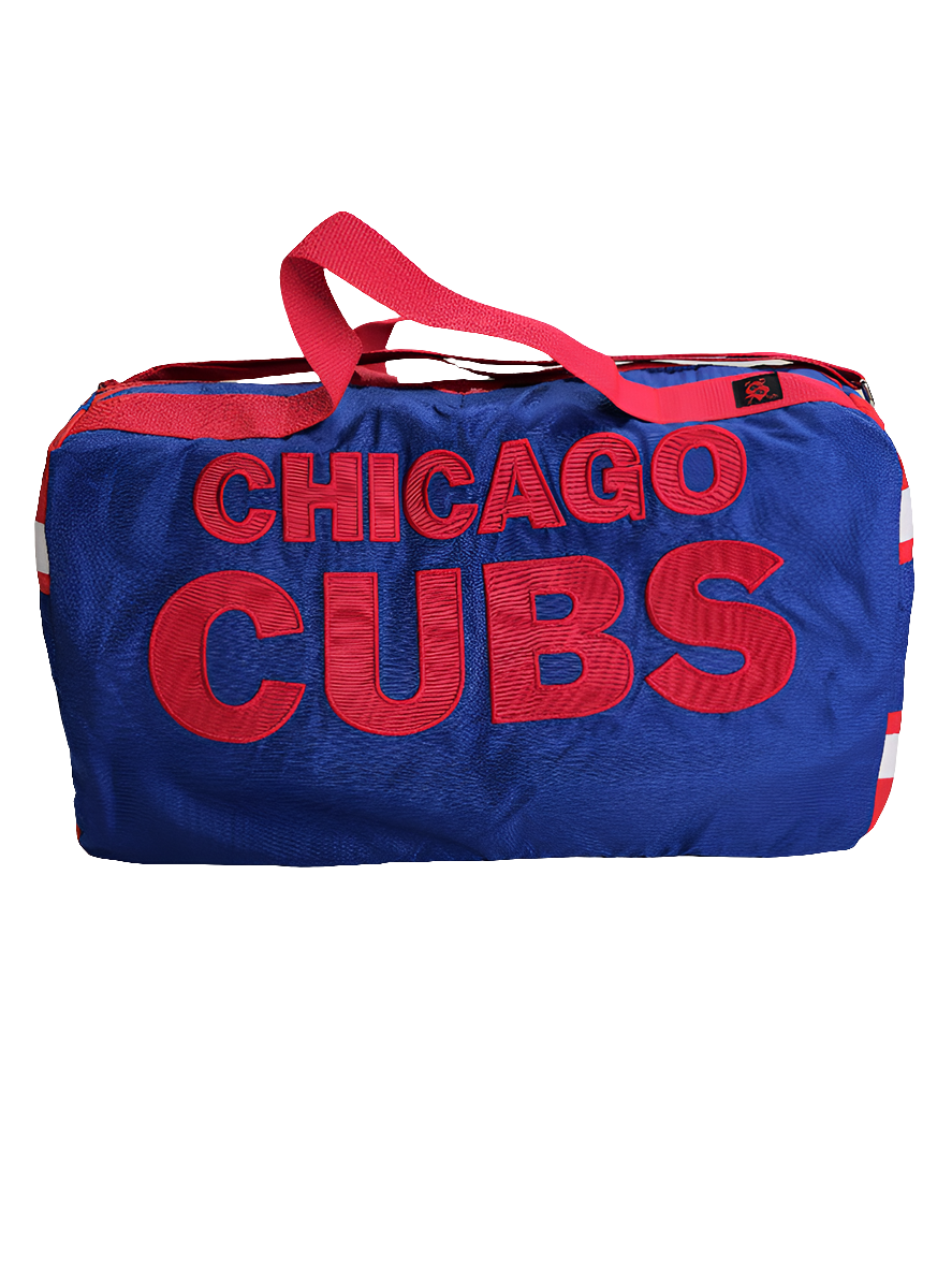 A handmade blue duffle bag with the text 'CHICAGO CUBS' in red letters, featuring a red adjustable strap and a branded logo on the side.