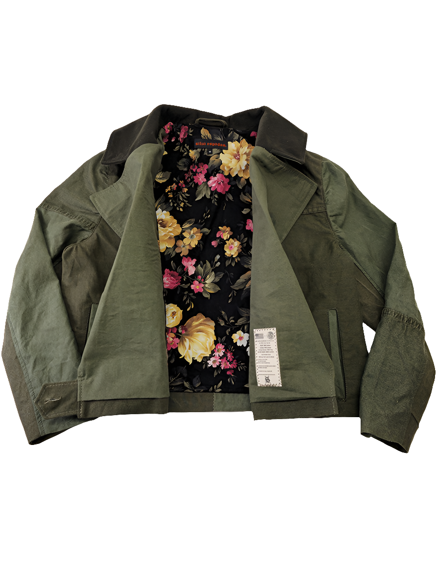 Inside view of cropped olive canvas jacket revealing bold deadstock fabric lining and vintage military canvas shell
