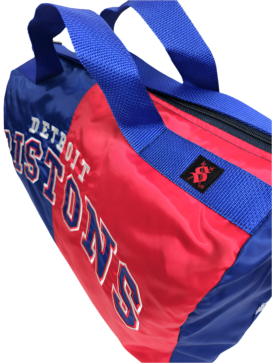 A custom handmade duffle bag made from a Detroit Pistons Starter jacket with the Pistons text logo
