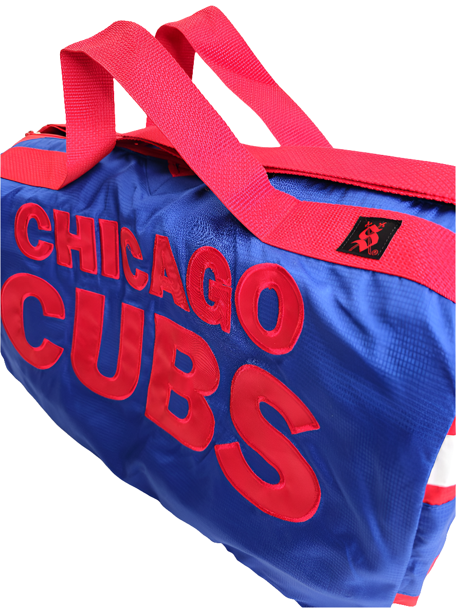 A handmade blue duffle bag with the text 'CHICAGO CUBS' in red letters, featuring a red adjustable strap and a branded logo on the side.