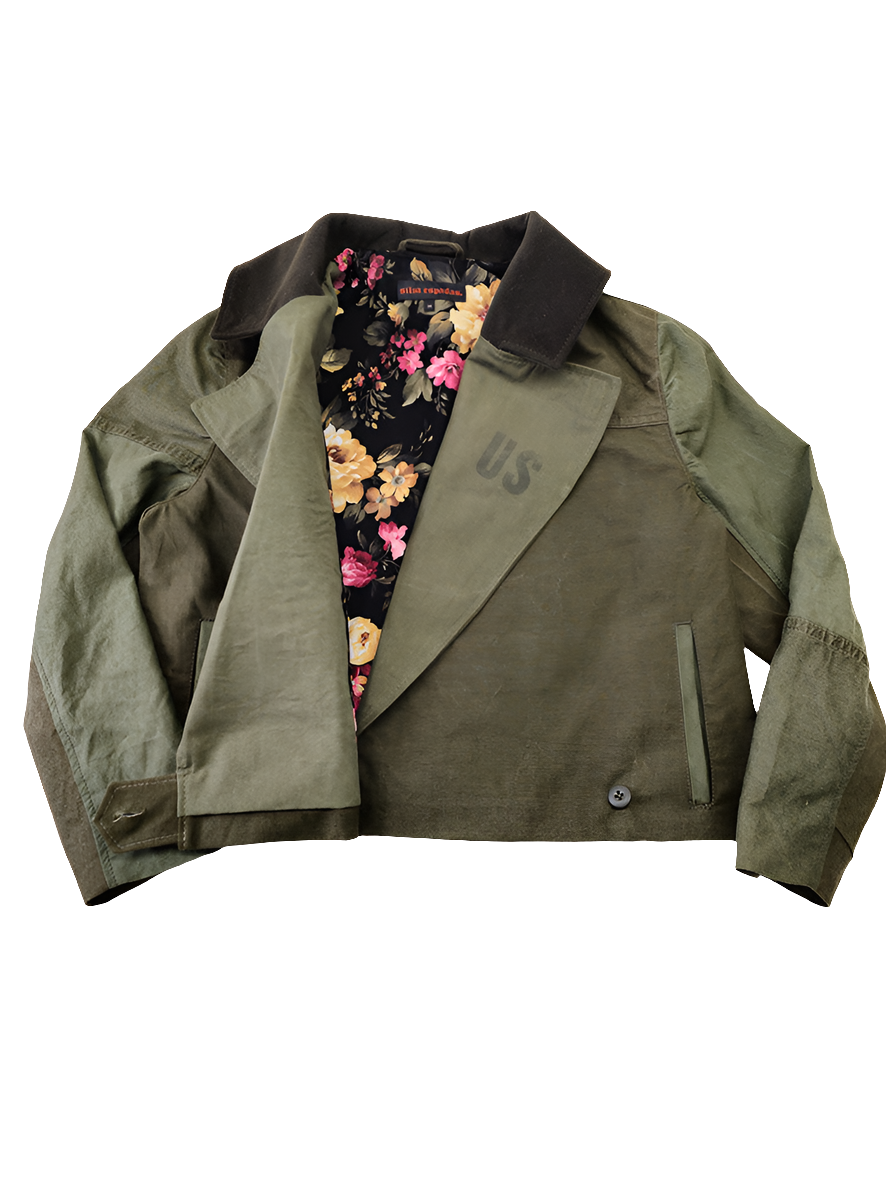 Inside view of cropped olive canvas jacket revealing bold deadstock fabric lining and vintage military canvas shell
