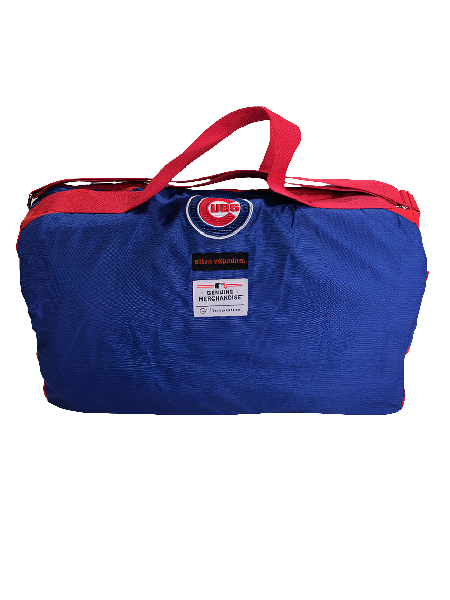 A handmade blue duffle bag with the  'CHICAGO CUBS' C logo in red letters, featuring a red adjustable strap and a branded logo on the side.