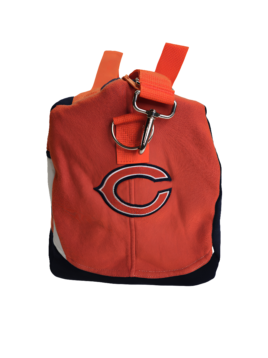 A navy and orange handmade duffle bag side view of Chicago Bears logo with orange straps