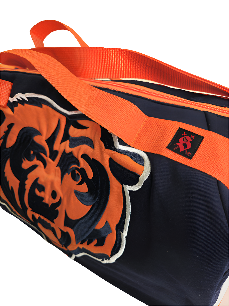 A navy and orange handmade duffle bag with a Chicago Bears logo 