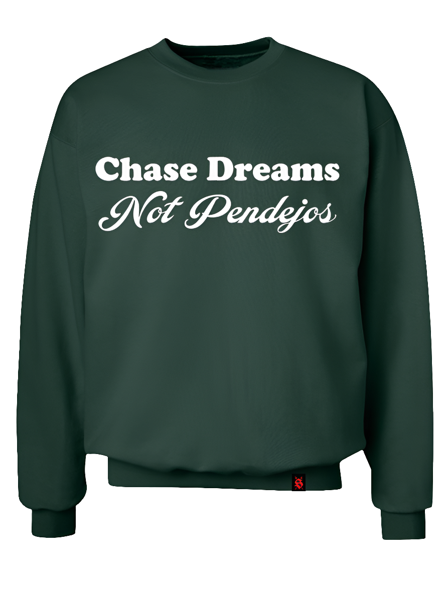 Forest green sweater with white graphic saying "Chase Dreams Not Pendejos"