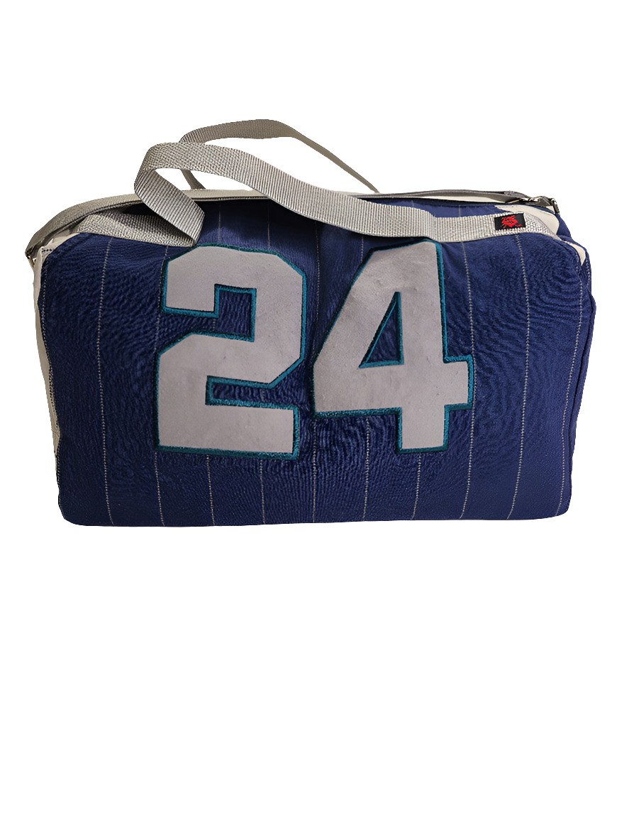 A custom handmade duffle bag made from a Seattle Mariners and heavy canvas, predominantly navy blue with white accents and the number 24