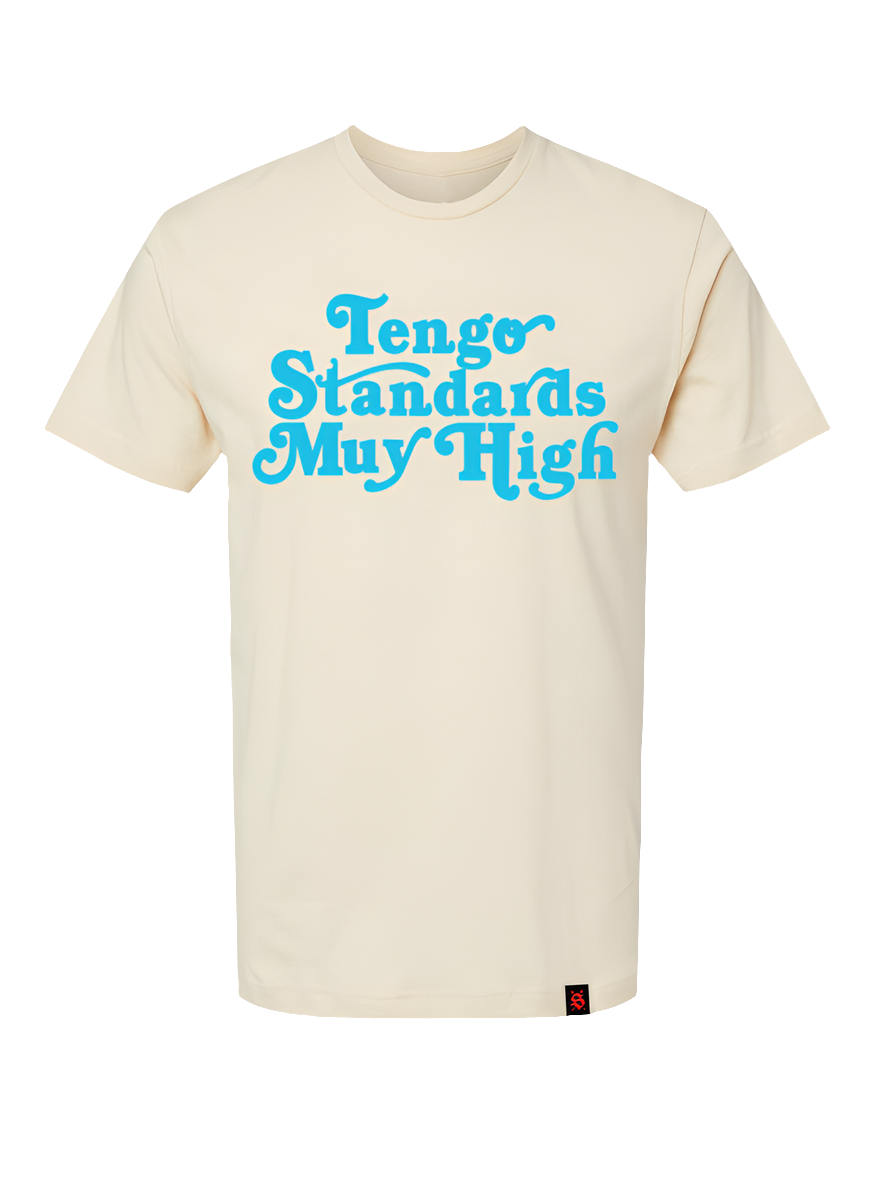 Off White t-shirt with 'Tengo Standards Muy High' text in blue screen print on the front.