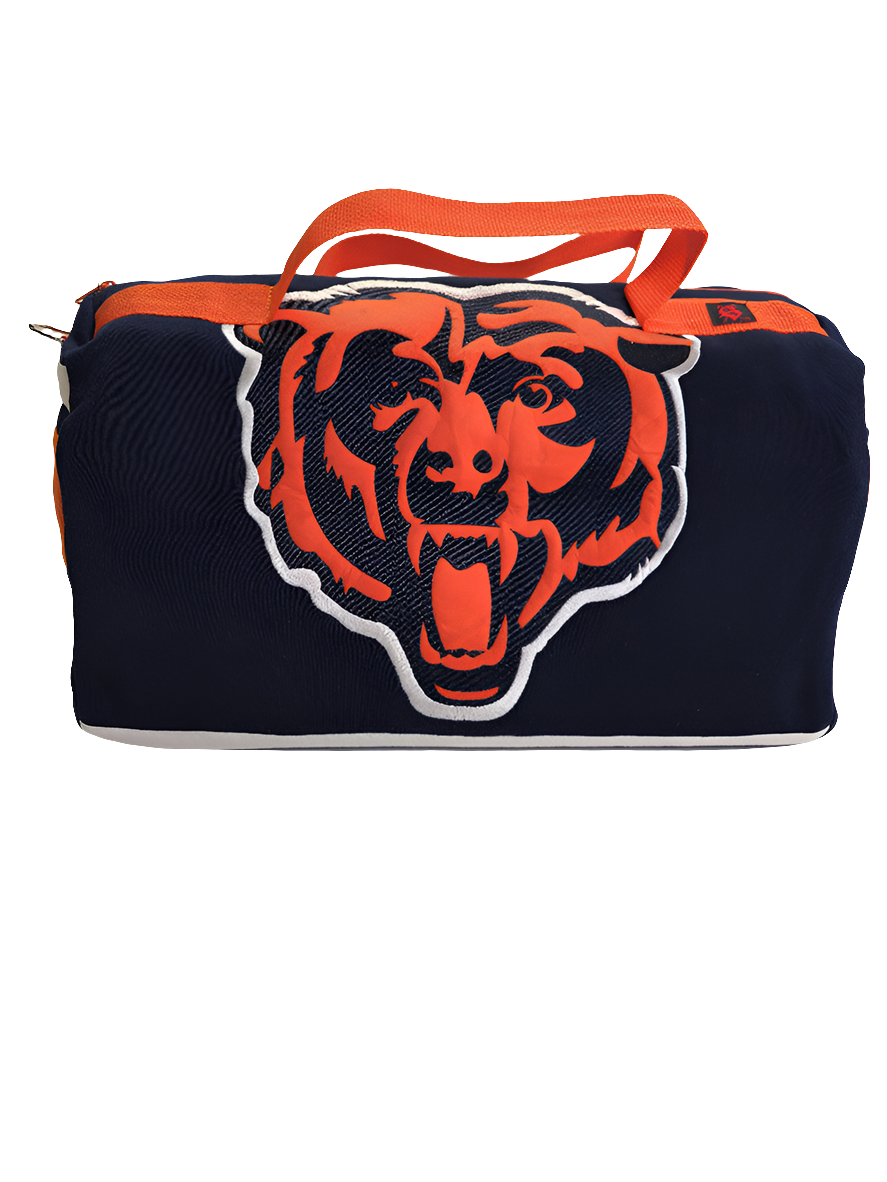 A custom handmade duffle bag made from a Chiago Bears Starter jacket and heavy canvas, predominantly navy blue with orange accents and the Bears logo