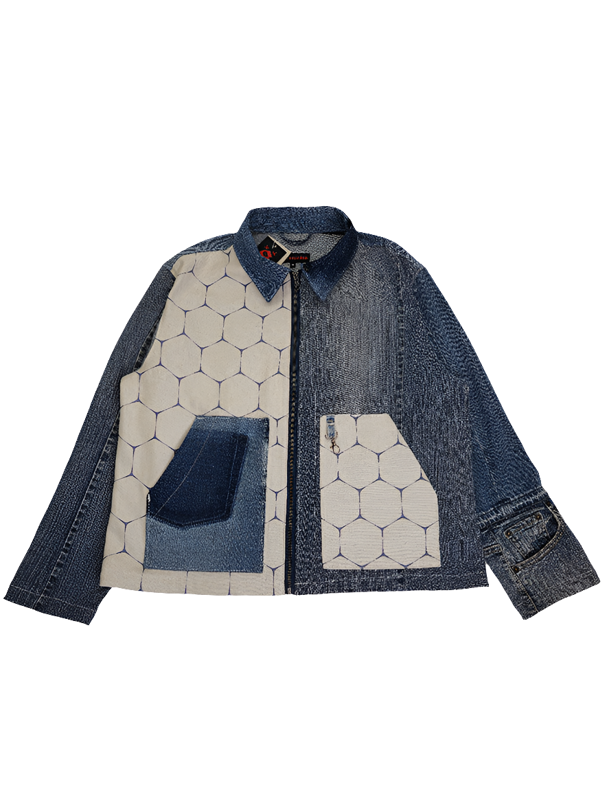 A denim honeycomb jacket with two slanted opening pockets on front panels and a boxy fit. The jacket features a mix of solid denim and honeycomb patterned fabrics.
