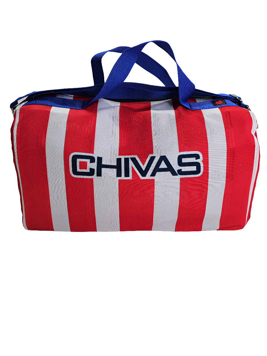A custom handmade duffle bag made from a Chivas jersey and heavy canvas, predominantly white with red accents and the Chivas logo.