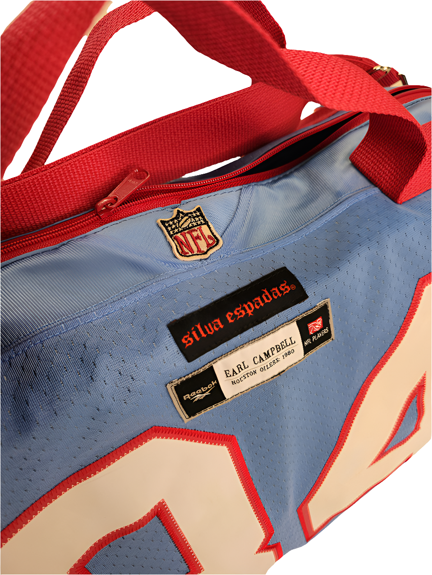 A custom handmade duffle bag made from a Houston Oilers Earl Campbell Reebok jersey in powder blue with red accents and the old school vintage Oilers logo