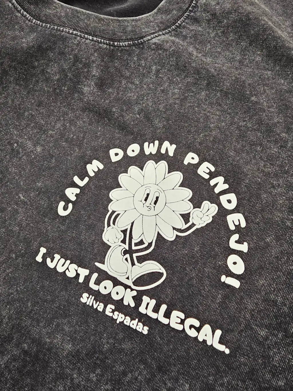 Black t-shirt with white graphic and text on a plain background