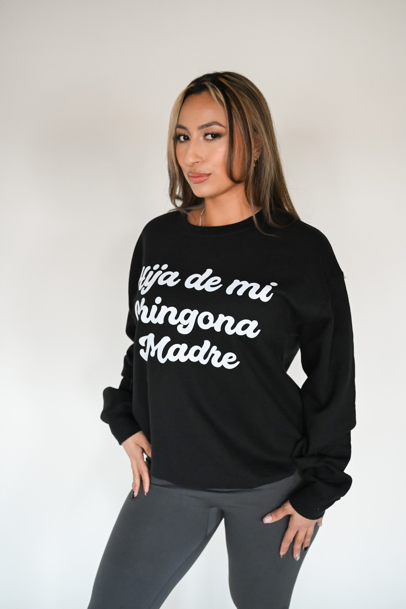 Model wearing Hija De Mi Chingona Madre Crewneck – unisex Mexican-inspired streetwear by Silva Espadas