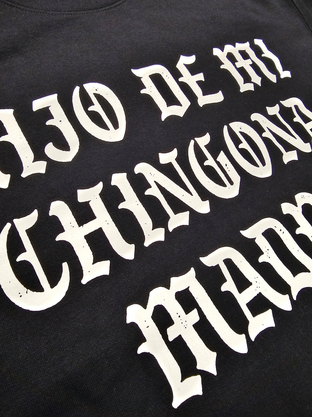 Detailed view of Hijo De Mi Chingona Madre screen print on Silva Espadas crewneck